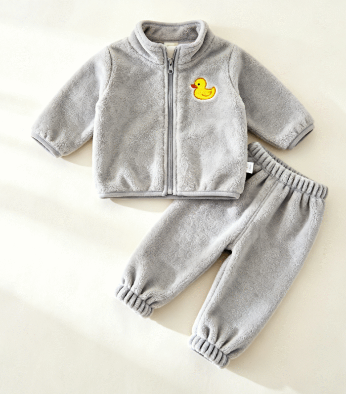 Gray zippered jacket paired with matching tapered pants