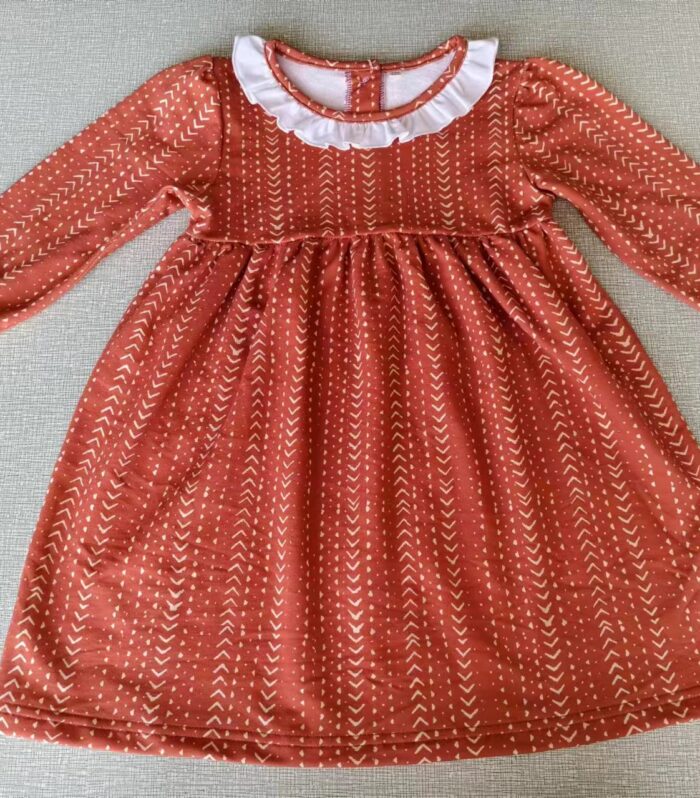 Girls Rust Arrow Print White Ruffle Neck Long Sleeve Dress