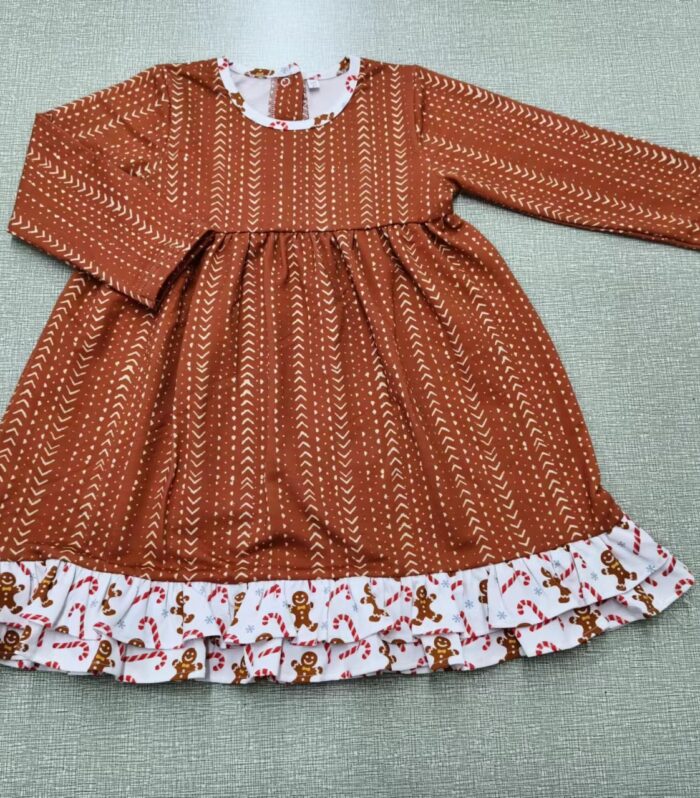 Girls Rust Arrow Print Swing Dress with Gingerbread Double Ruffle Hem