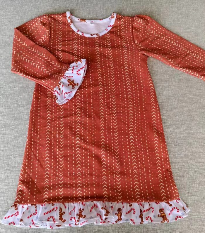 Rust Arrow Print Swing Dress with Gingerbread Ruffle Hem